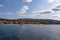 Mt Athos - Panoramic view from boat tour on Ouranoupolis town nd ancient Tower of Ouranoupolis on peninsula Mount Athos