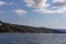 Mt Athos - White seagull flying along the coastline of peninsula Athos, Chalkidiki, Central Macedonia, Greece, Europe