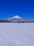 Mt.Fuji in April with a clear blue sky and snowy scenery from Oshino Village