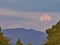 Mt. Fuji and the moonset of flower moon in May, 2020 viewed from Tokyo, Japan