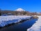 Mt. Fuji in snowy scenery from Shinnasyo River in Oshino Village