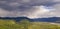 Mt St Helens Peaks out from between the clouds in Washington State