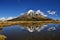 Mt Taranaki volcano reflection in the pond with snowy peak