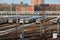 MTA Coney Island train yard with several parked nyc trains and skyscrapers visible in the background