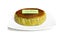 Mtacha Basque burnt cheese with birthday plate isolated in white background.