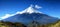 Mtfuji tallest volcano in tokyo, japan, snow capped peak in autumn with red trees, nature landscape