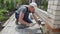 Mtsensk, Russia 24 May 2017. EDITORIAL - Bricklayer lays paving stone mosaic.