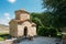 Mtskheta Georgia. Ancient Tiny Stone Church Of St. Nina With Green Churchyard