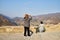 Mtskheta, Georgia - October 25, 2019: Tourist on the observation deck in the mountains. Travelers in Georgia near the Jvari