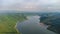 Muak Lek reservoir in Saraburi from aerial bird eye view. Beautiful unseen nature at Muak Lek dam with roadway beside with water a