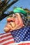Muammar Gaddafi behind the American Flag