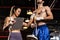 Muay Thai boxer step on weight scale for boxing class designation. Impetus