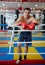 Muay thai fighter resting in the ring