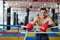 Muay thai fighter resting in the ring