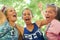 So. Much. Excitement. Cropped portrait of a group of girlfriends having fun at an outdoor festival.