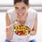 So much fresh goodness. High angle portrait of an attractive young woman eating a bowl of salad.