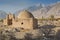 Mud building on Karakoram Highway, ChinaÃ¢â‚¬â„¢s Xinjiang region. Truck on the Old Silk road