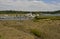 The mud flats at Bucklers the Beaulieu River in Hampshire, England at low tide with boats on their moorings