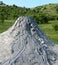 Mud volcano flowing down clayey mud mixed with hydrocarbons. Natural Reserve Salse of Nirano: Modena, Italy