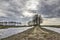 Muddy footpath under a dramatic sky