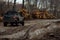 A muddy, impassable country road where cars get stuck