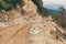 Muddy road and off-road vehicle on the way to Bumthang to Wangduephodrang.