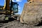 Muddy tracks and bucket of a backhoe