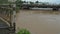 Muddy water from the river of the flood affected river flooded in the bridge