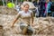 Muddy woman in a mud run.