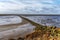 Mudflat Rocks and sea breakers off the Frisian coast, Netherlands along the Dutch coast