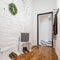 Mudroom with brick wall