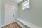 Mudroom interior with a seating area with shoe storage at the bottom