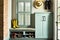 A mudroom with a shutter shoe cabinet is a common piece of furniture in an American-style entryway, copy space