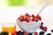 Muesli bowl with fresh orange juice.