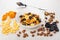Muesli in bowl, scattered dried fruits, cornflakes and nuts, spoon