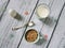 Muesli, cereal in cup, milk and egg. healthy breakfast scene on white wooden background. Top view photo