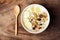 Muesli with cereal, slice banana and milk in a bowl