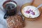 Muesli with fresh raspberries and milk, bread and coffee, typical Scandinavian breakfast