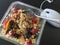 Muesli with fruits, nuts and oatmeal on writing desk