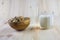 Muesli, granola and milk in blurred wooden background. (Shallow aperture intended for the aesthetic quality of the blur)