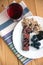 Muesli snack bar, blueberries and berry tea