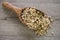 Muesli in a wooden spoon