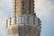 A muezzin singing his prayer on a Minaret.