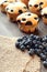 Muffin with blueberries on a wooden table.