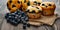 Muffin with blueberries on a wooden table. fresh berries and sweet pastries on the board