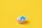 Muffin with easter blue eggs and bird. Springtime concept. Creative conceptual photo