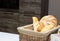 Muffin lies in the kitchen in a small basket, loaves, bread and rolls. Bad food, fullness, copy space
