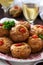 Muffins with cheese, cottage cheese and tomatoes, vegetables and cheese served with wine