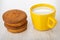 Muffins, cup with milk on wooden table