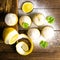 Muffins with lemon and mint on a cutting board on dark wooden table. Top views, close-up